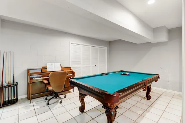 a view of a patio with a table chairs and a backyard
