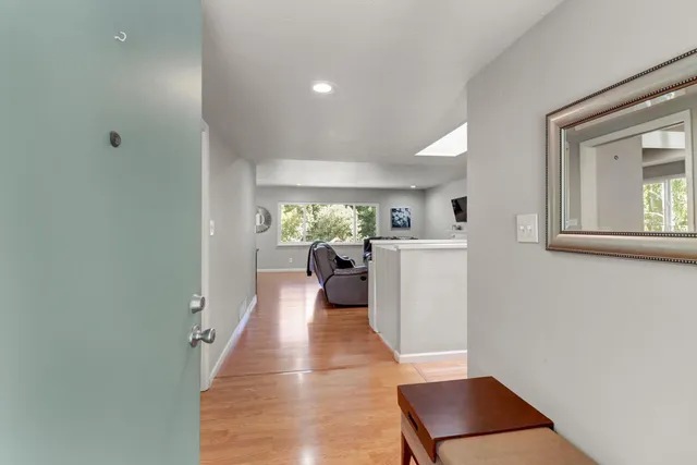 a view of living room with furniture and a window