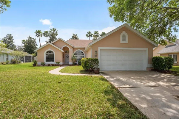 a front view of a house with yard