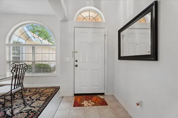 a view of an entryway with wooden floor