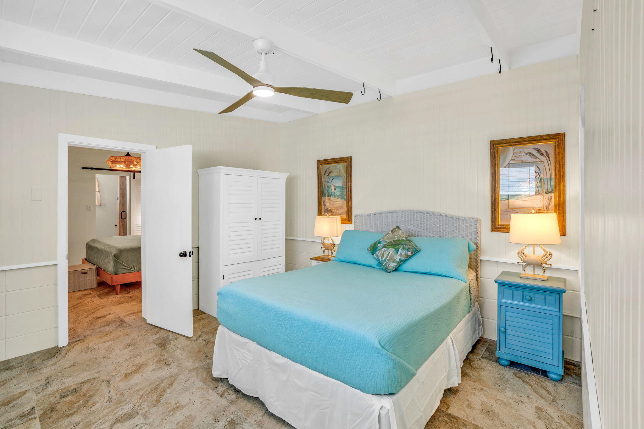 41 Sadowski Causeway Key Colony Beach, FL 33051 - Photo 21 of 40 a bedroom with a bed and a table