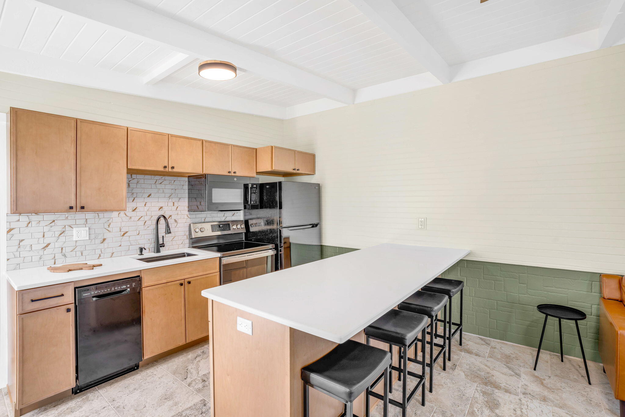 41 Sadowski Causeway Key Colony Beach, FL 33051 - Photo 26 of 40 a kitchen with a sink a stove and chairs