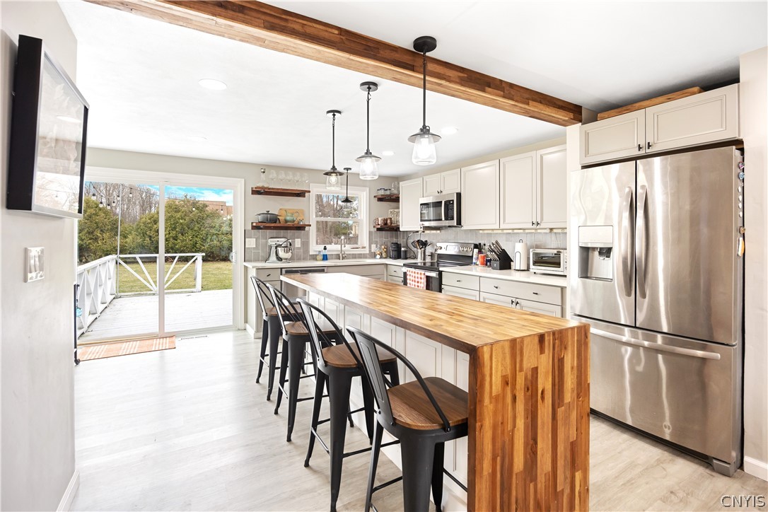 69 Lyndon Road De Witt, NY 13066 - Photo 8 of 30 The sliding door opens to a large deck and huge ba