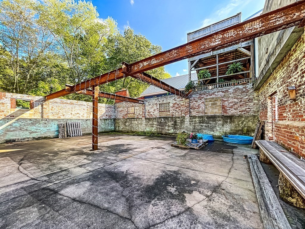 164 A Depot Road Hatfield, MA 01066 - Photo 27 of 40 a view of a backyard with a patio and a couch