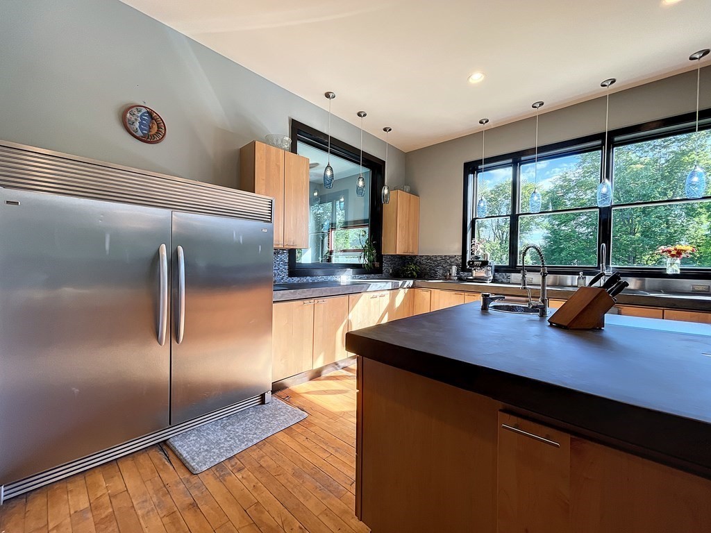 164 A Depot Road Hatfield, MA 01066 - Photo 3 of 40 a kitchen with stainless steel appliances a sink stove and a large window