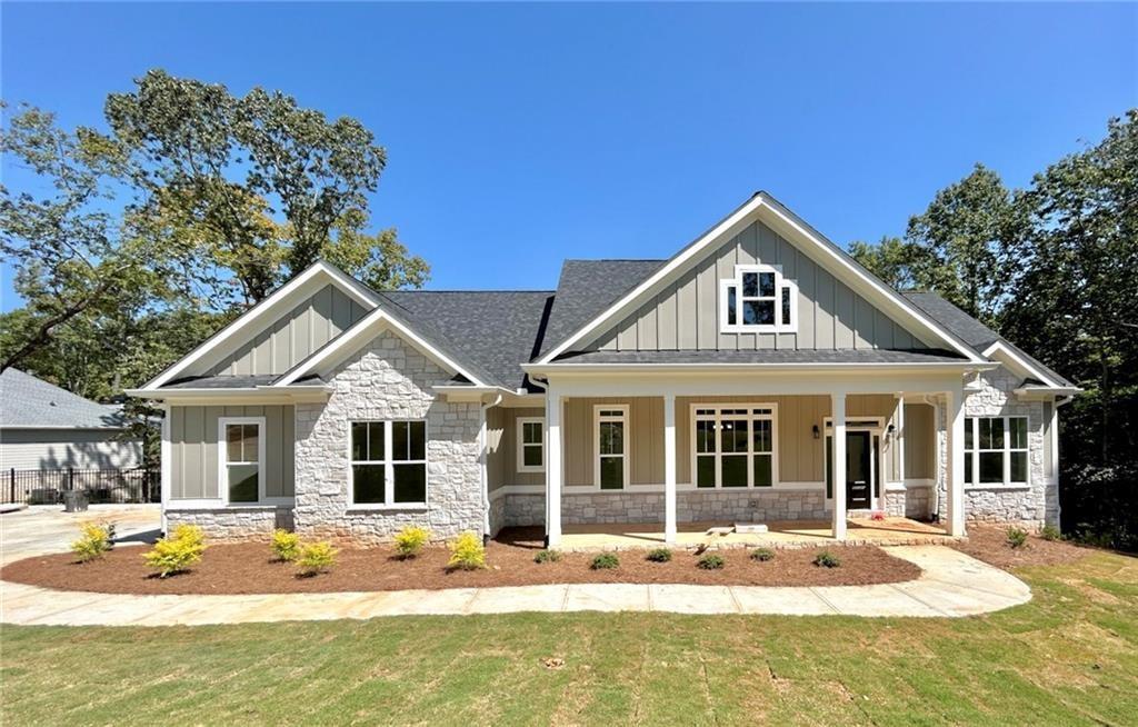 31 Cedar Gate Lane Kingston, GA 30145 - Photo 1 of 1 a front view of a house with swimming pool and glass windows