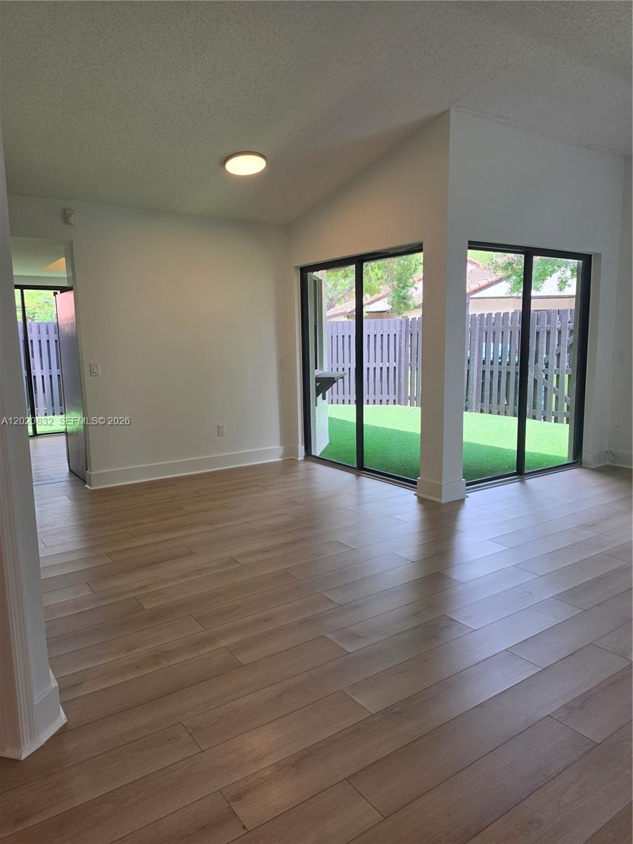 15240 Southwest 45th Terrace, Unit 54F Miami, FL 33185 - Photo 40 of 48 a view of livingroom with hardwood floor and window