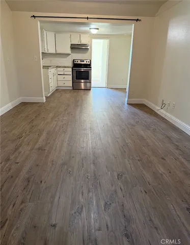 a view of kitchen and wooden floor
