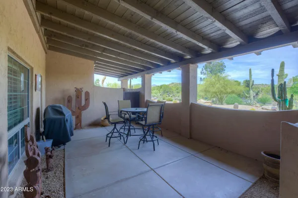 a view of a livingroom with furniture and a window