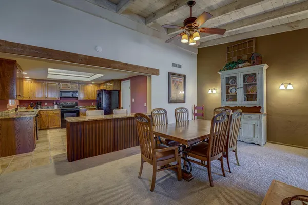 a dining room with furniture and window