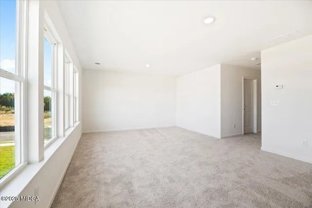 an empty room with windows