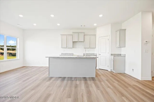 a view of kitchen with wooden floor