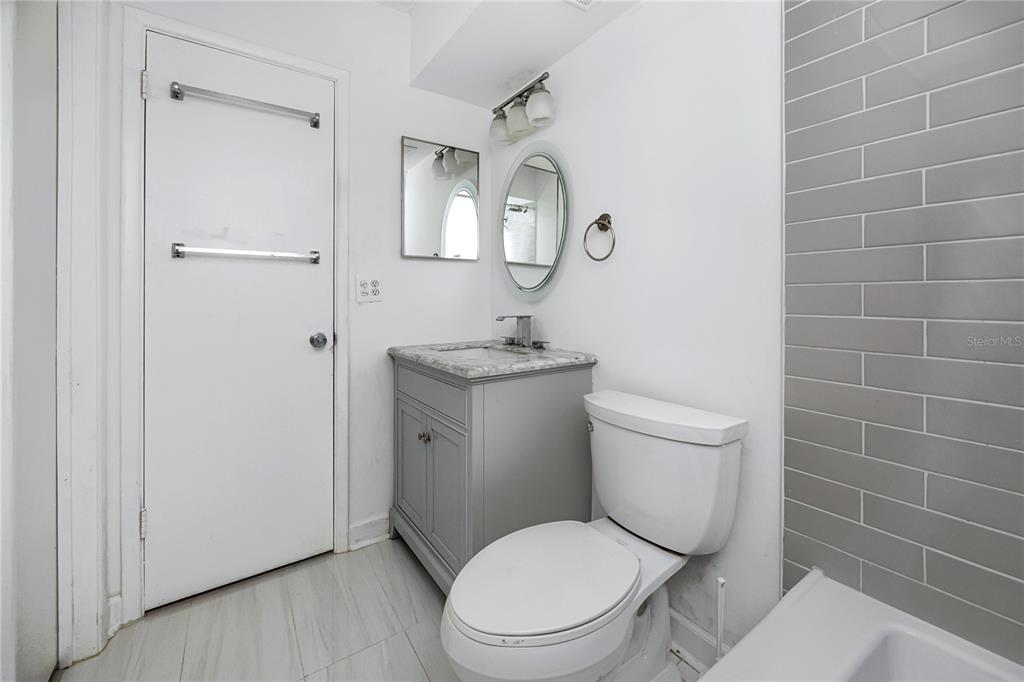 2207 Belleair Road, Unit B4 Clearwater, FL 33764 - Photo 27 of 37 a white toilet sitting next to a bathroom sink
