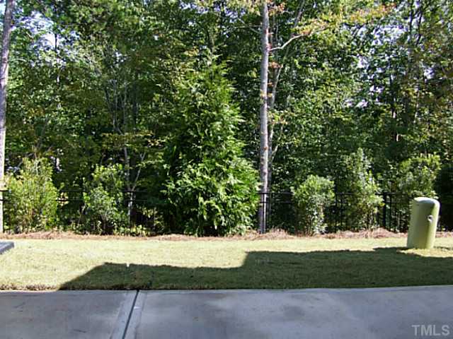 7839 Allscott Way Raleigh, NC 27612 - Photo 2 of 5 View out of you sliding doors! Nice mature trees that will look beautiful with color in a month!