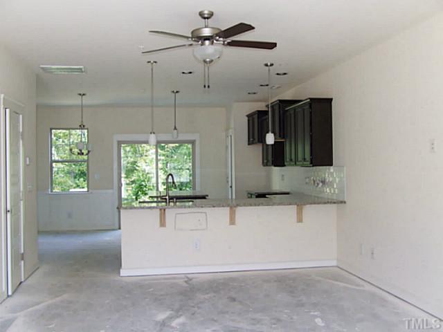 7839 Allscott Way Raleigh, NC 27612 - Photo 3 of 5 Looking from the FR into the kitchen/DR to the left of the kitchen.
