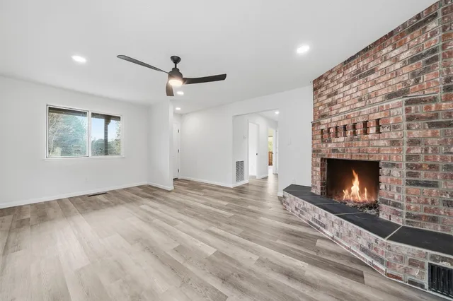a kitchen with stainless steel appliances granite countertop a stove microwave and sink