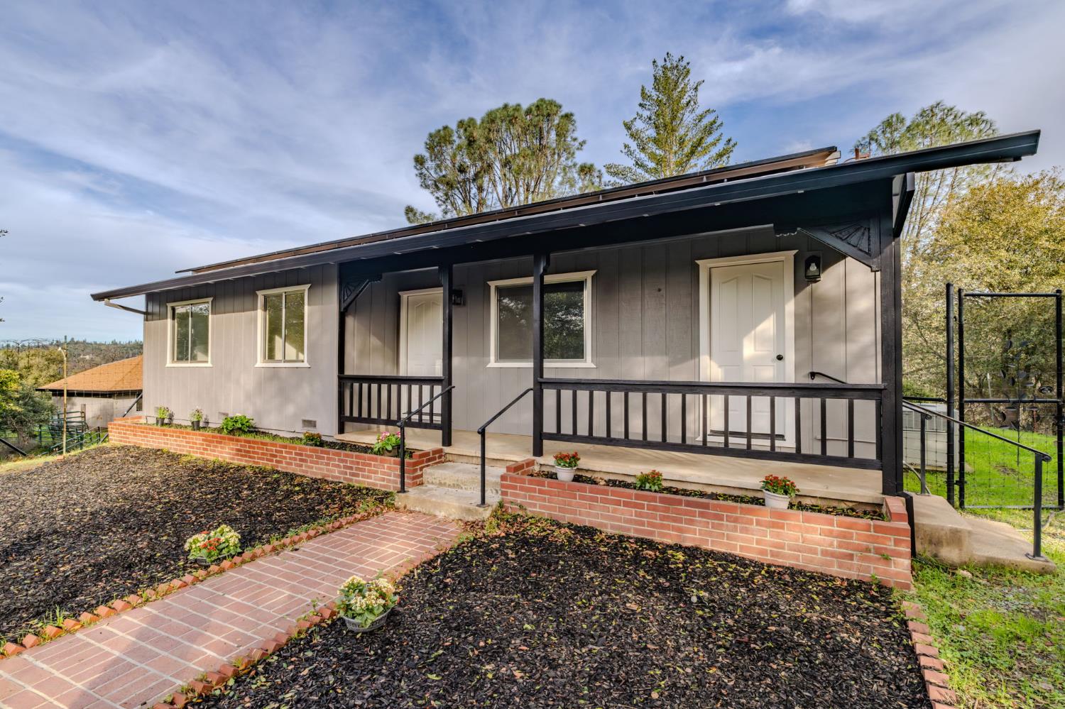 13171 Ridge Court Sutter Creek, CA 95685 - Photo 4 of 66 a front view of a house with a porch