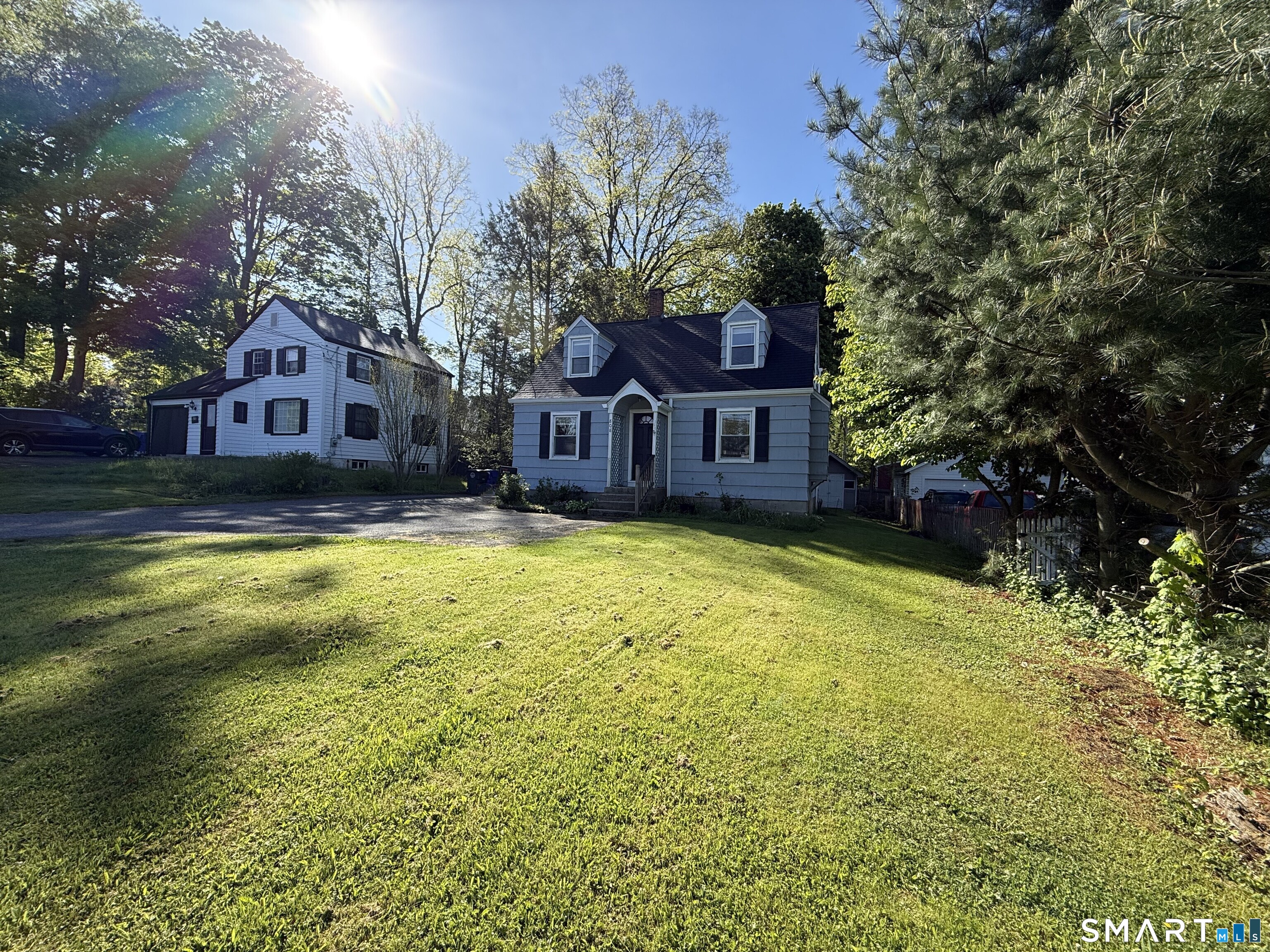808 East Main Street Torrington, CT 06790 - Photo 3 of 40 a view of a house with swimming pool next to a yard