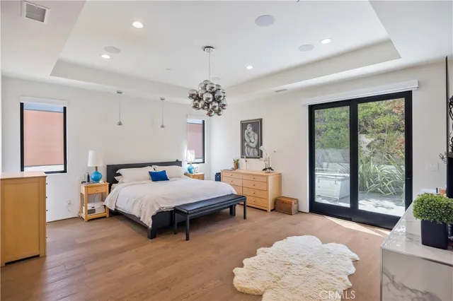 a view of an empty room and wooden floor