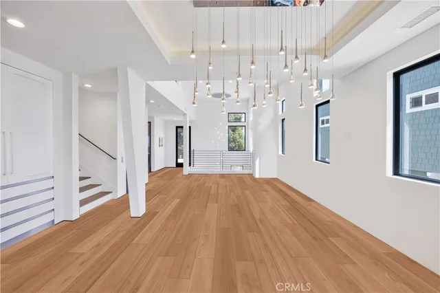 a view of a house with a small yard and floor to ceiling window