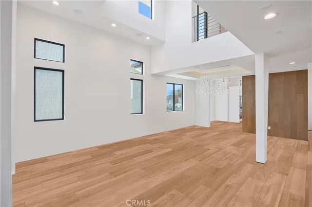 a view of a terrace with chairs and wooden fence