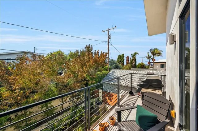 an aerial view of residential house with outdoor space and swimming pool