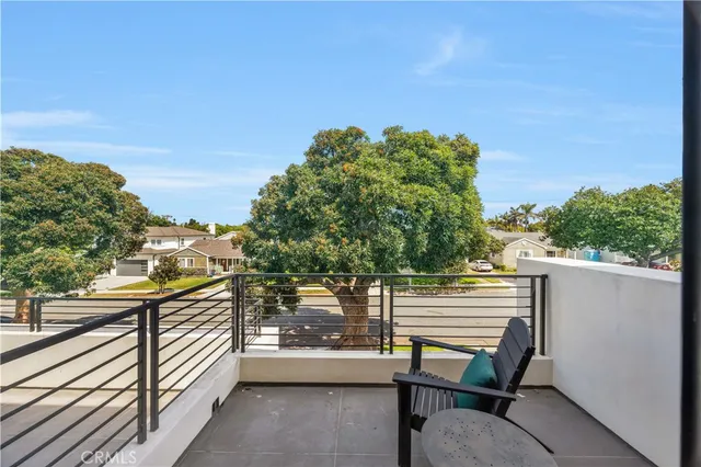 an aerial view of residential houses with city view