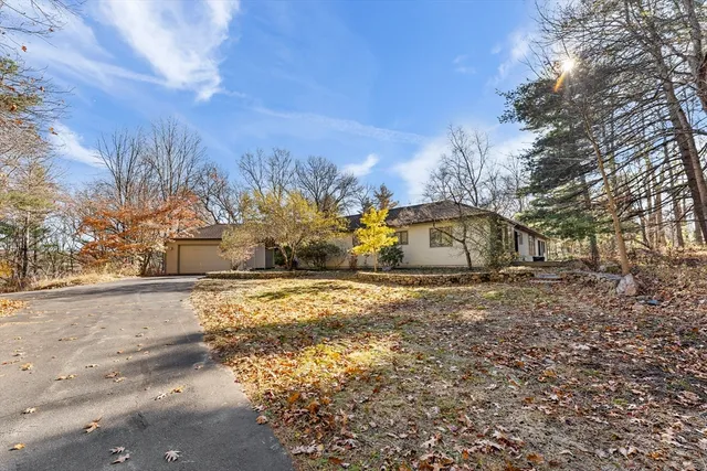 a view of a balcony with wooden floor and fence