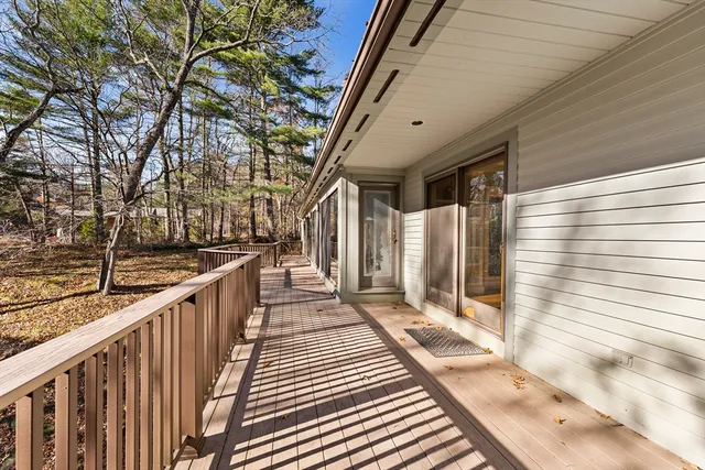 a spacious bedroom with a large bed and a large window