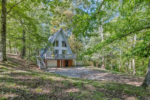 a house with trees in front of it