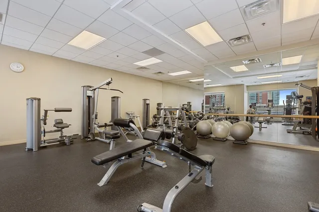 a room with gym equipment and lots of gym equipment