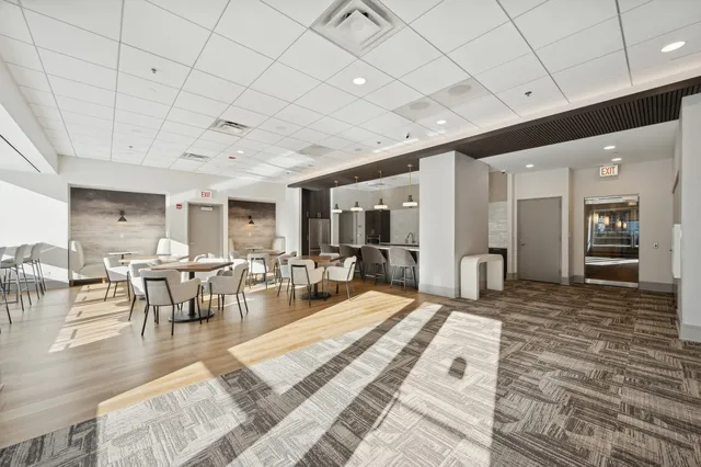 a living room with lots of furniture and a table