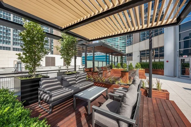 a view of a patio with wooden floor
