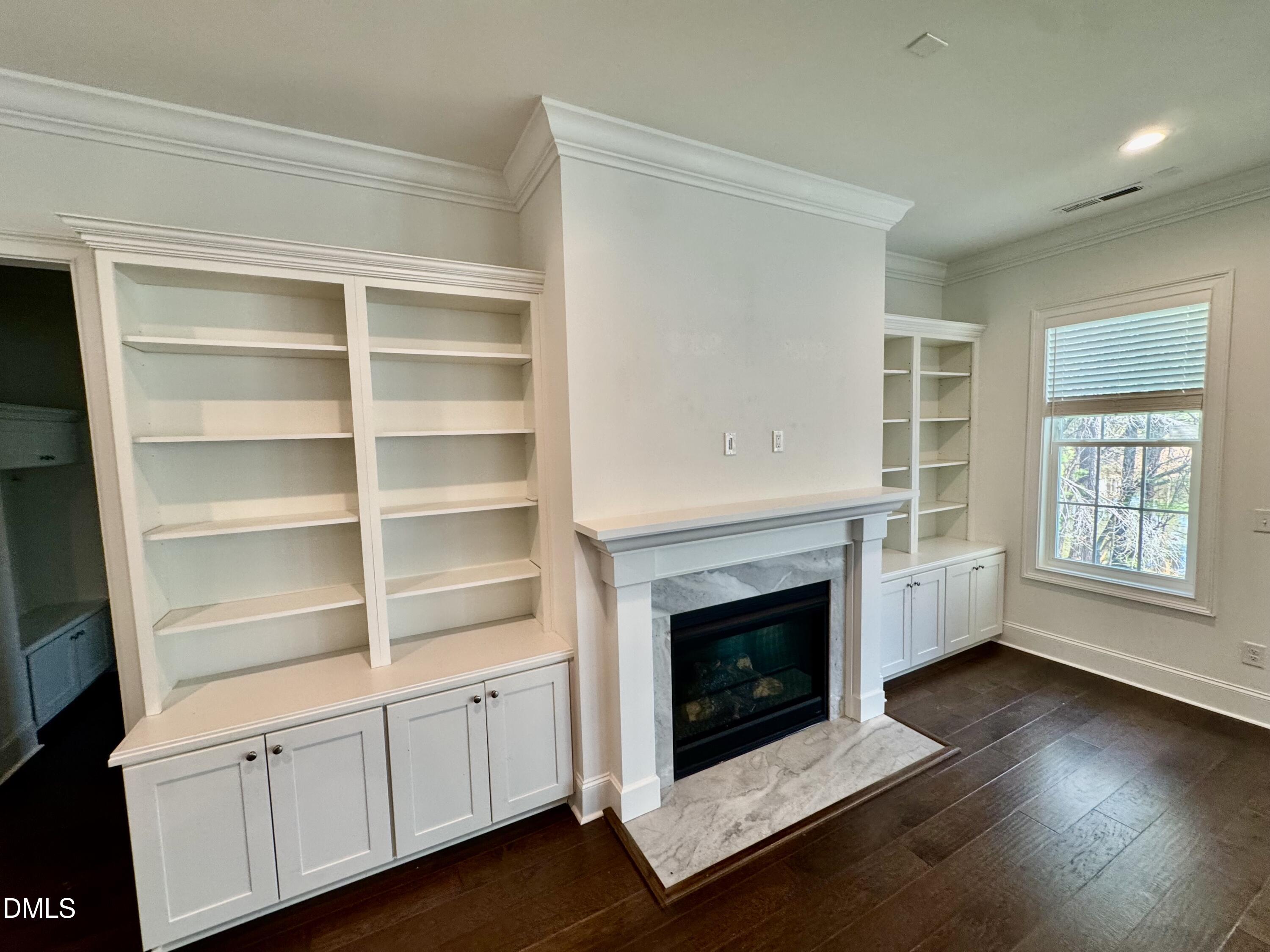 1329 Sandybrook Lane Wake Forest, NC 27587 - Photo 3 of 16 a living room with hard wood floors and a fireplace