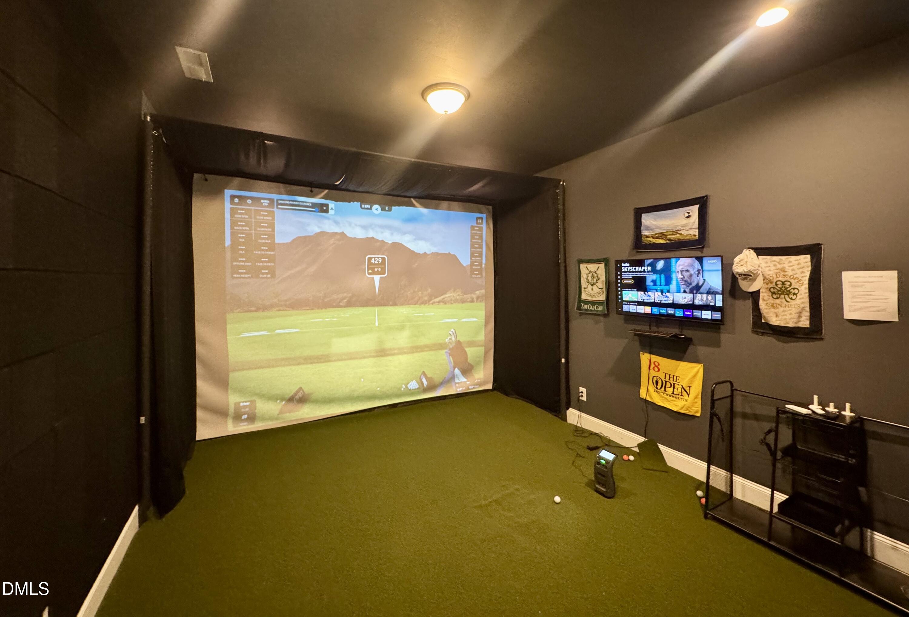 1329 Sandybrook Lane Wake Forest, NC 27587 - Photo 8 of 16 a view of a room with projector and screen