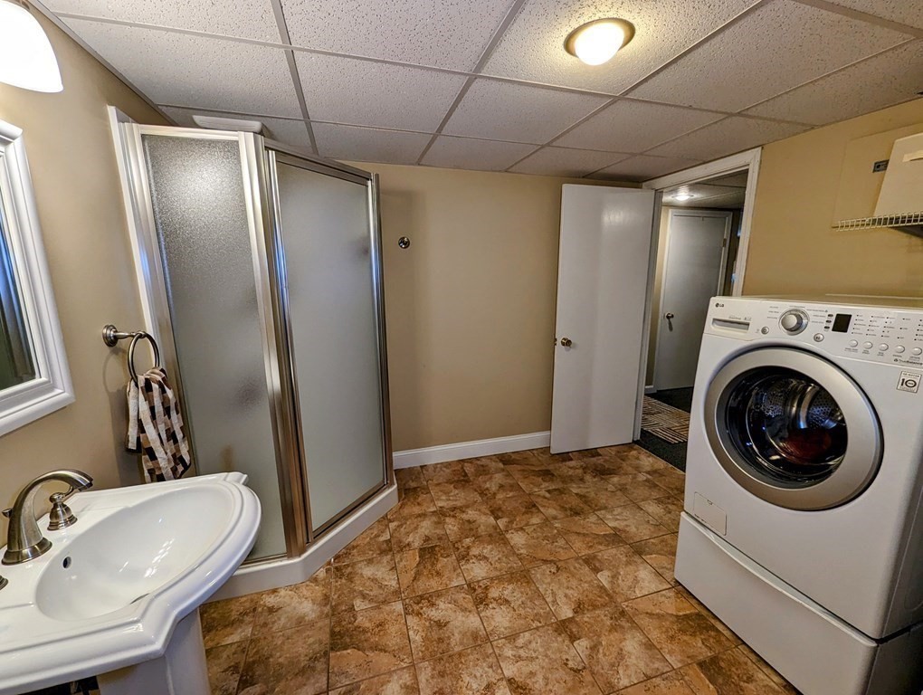 56 Colburn Road Charlton, MA 01507 - Photo 16 of 40 a bathroom with a sink a toilet and a mirror