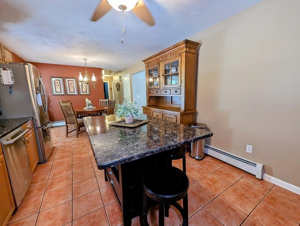 56 Colburn Road Charlton, MA 01507 - Photo 33 of 40 a dining room with furniture and wooden floor