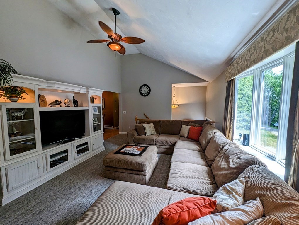 56 Colburn Road Charlton, MA 01507 - Photo 5 of 40 a living room with furniture and a flat screen tv