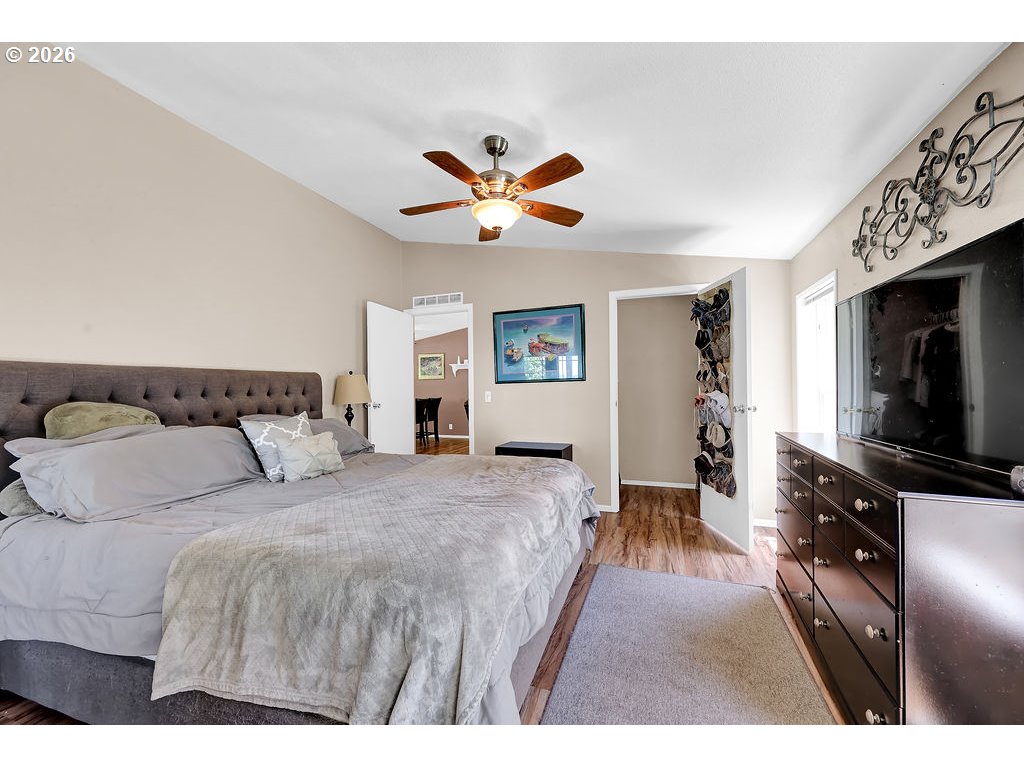 35235 Row River Road Cottage Grove, OR 97424 - Photo 12 of 28 a bedroom with a bed and a flat screen tv