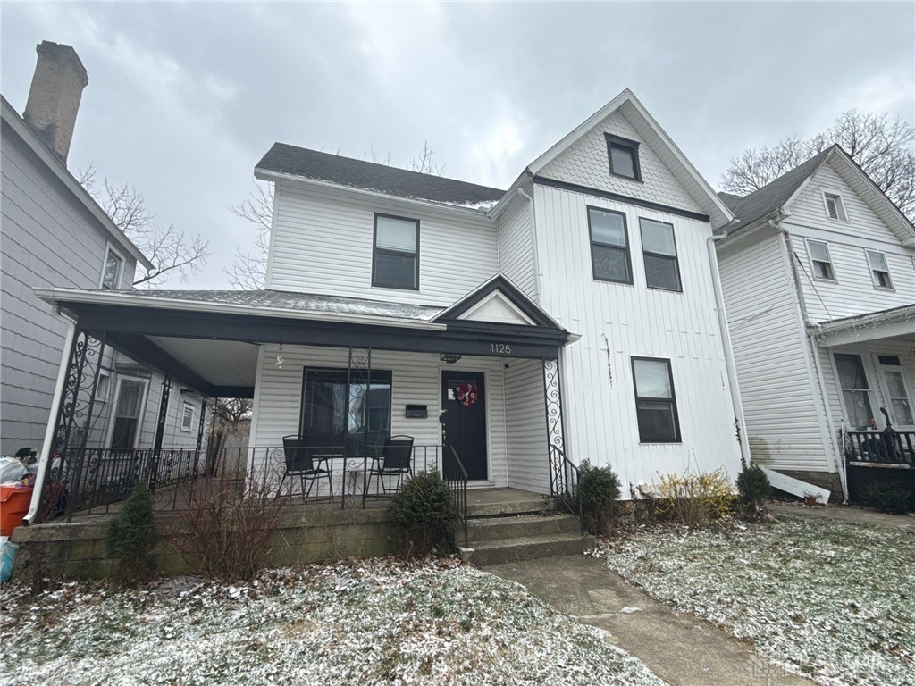 1125 West High Street Springfield, OH 45506 - Photo 1 of 39 This classic white home features a charming covered front porch, perfect for welcoming guests.