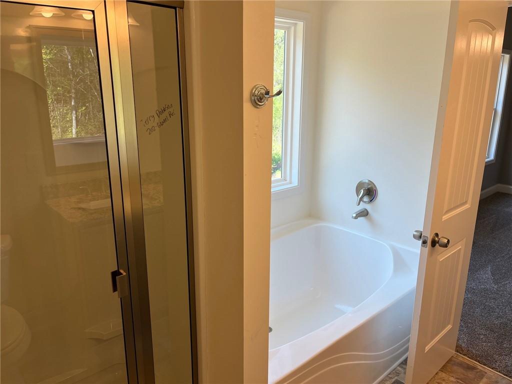 202 Gamel Road Dallas, GA 30157 - Photo 18 of 34 a white bath tub sitting next to a shower