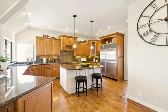 a dining room with furniture window and wooden floor