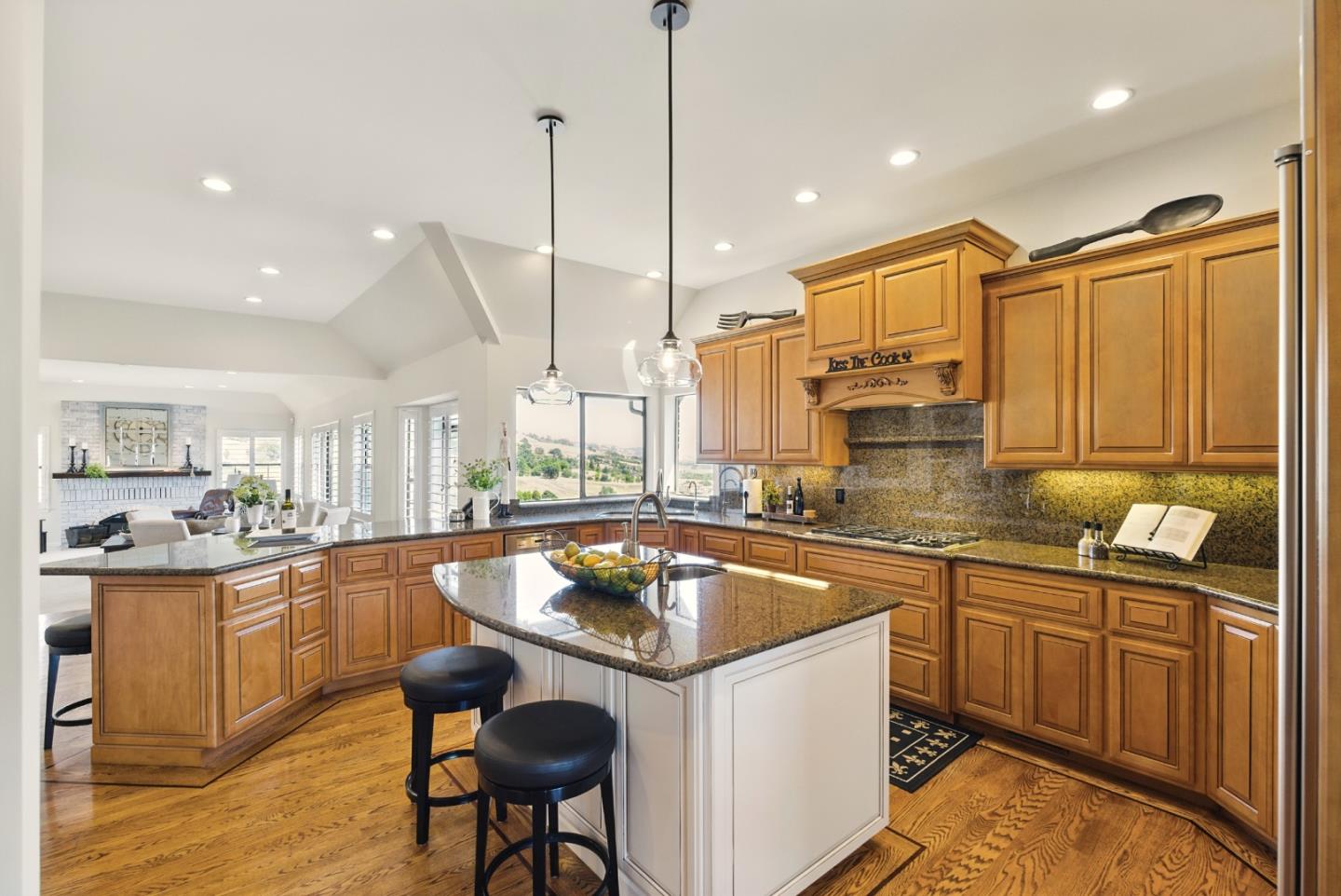2525 Bridle Path Drive Gilroy, CA 95020 - Photo 16 of 85 a kitchen with stainless steel appliances granite countertop a sink a stove and a wooden floors