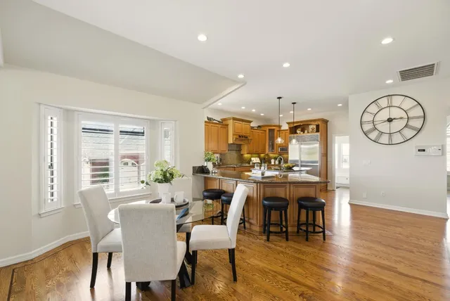 a view of a livingroom with furniture wooden floor and a rug