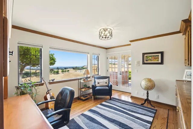 a bedroom with a bed and dresser with mirror