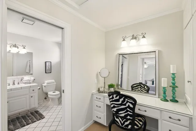 a view of a house with sitting area and potted plants