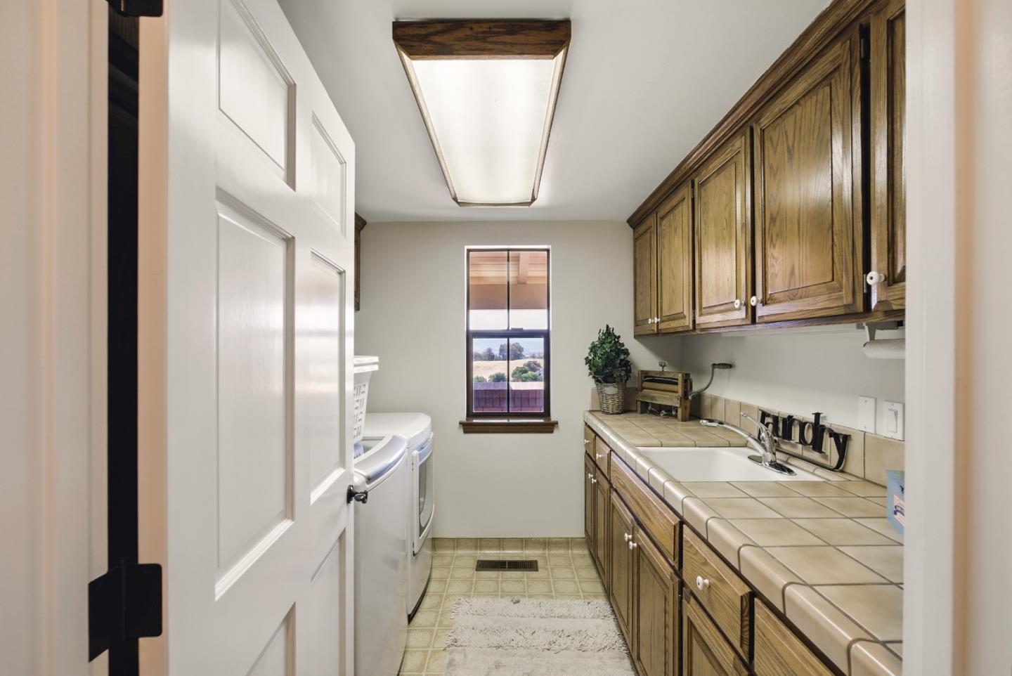 2525 Bridle Path Drive Gilroy, CA 95020 - Photo 38 of 85 a kitchen with a sink stove and cabinets