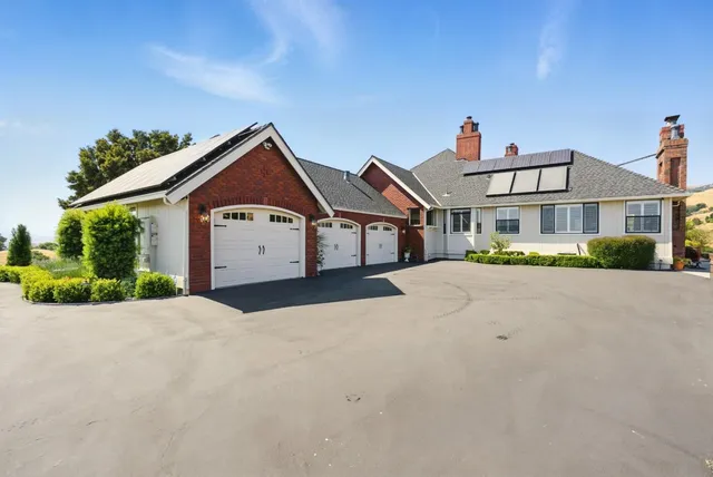 a view of a room with gym equipment and windows