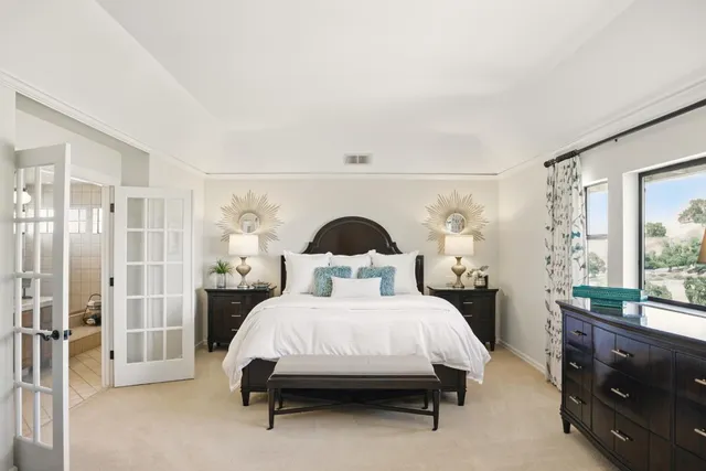 a view of a balcony with two chairs and a table