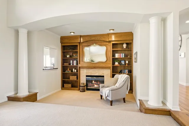 a bathroom with a granite countertop sink a toilet and a mirror